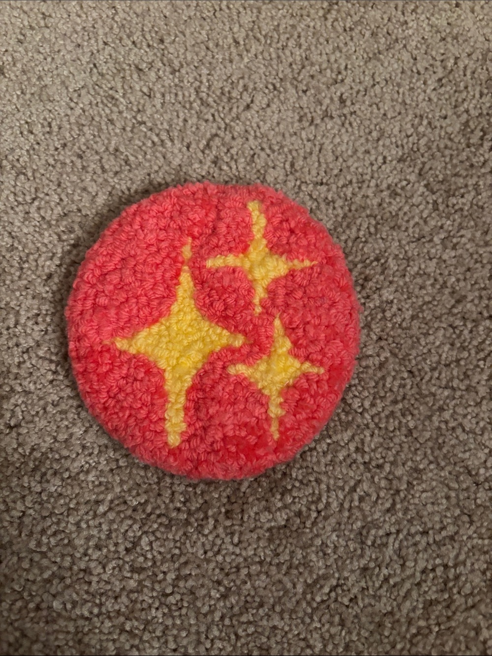 Handmade Round Pink Coaster with Yellow Starburst Design